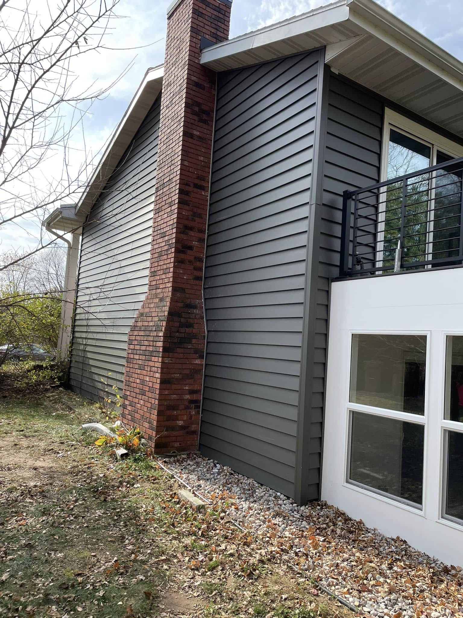chimney finish with black home siding
