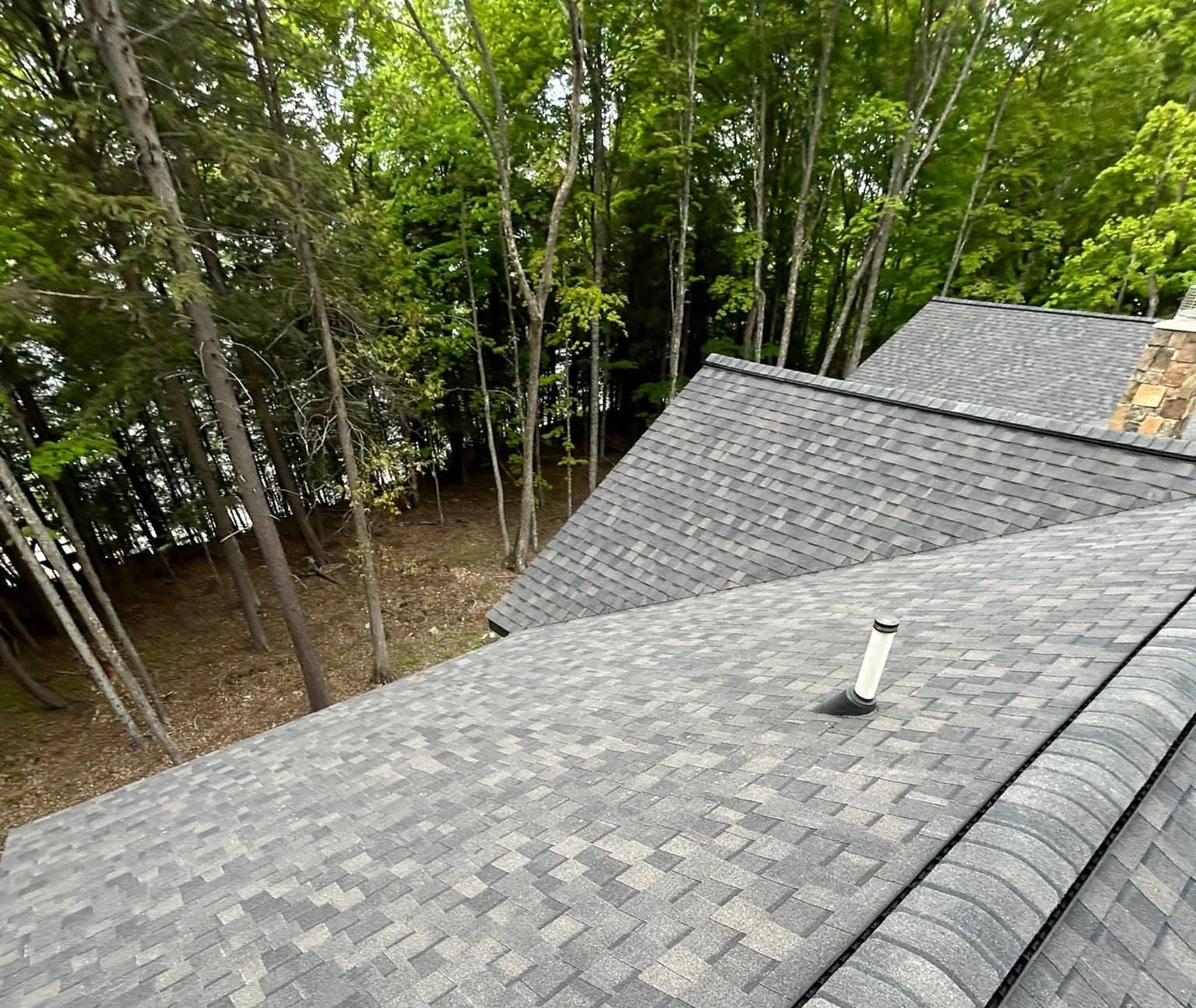 new roof installation with asphalt shingles