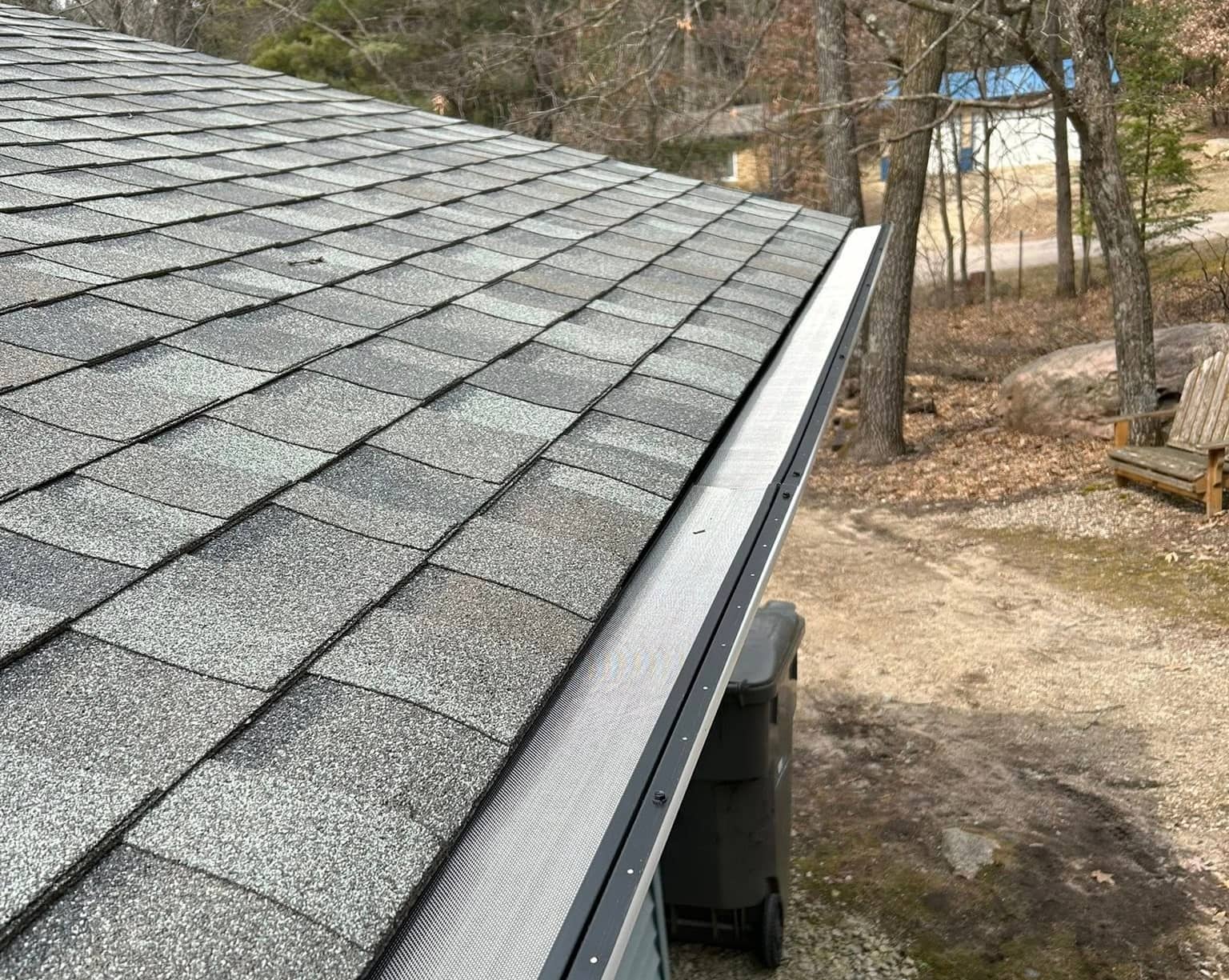 new roof asphalt shingles and gutters installation