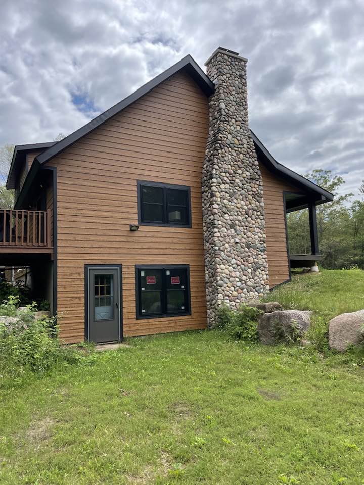 wood siding with brand new chimney